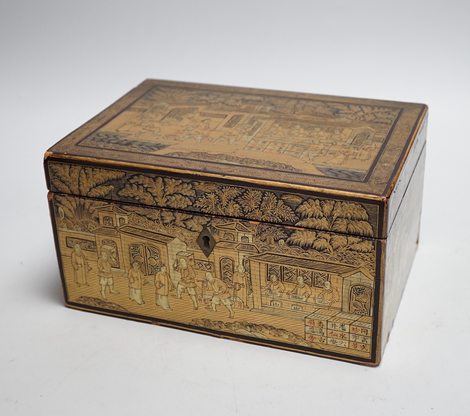 A 19th century Chinese export lacquer tea caddy, black ground with gilt decoration, containing a separate lidded pewter lining box with engraved decoration, 23cm x 16cm x 12cm